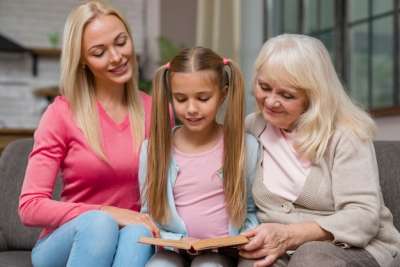 girl with her mom and grandma