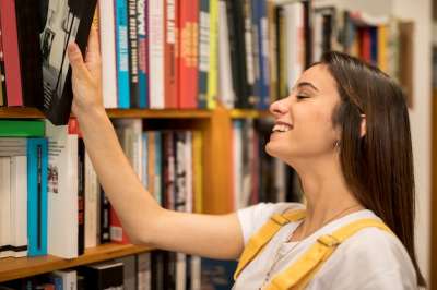 woman chooses a book
