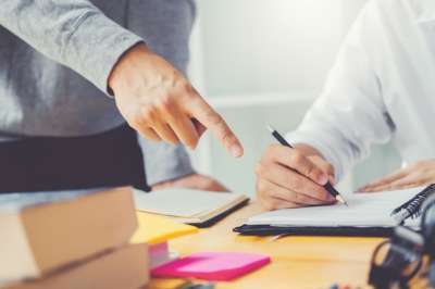 student's desk with materials flatlay desk with materials and books