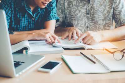 doing homework students in the library