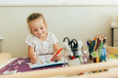 cute little girl drawing a picture girl drawing
