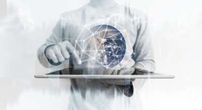 man with a tablet showing a 3D model of global network connection technology man with a tablet showing global network"