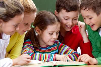 children looking in the book