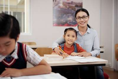 asian teacher and a young student