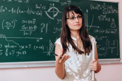 teacher by the blackboard