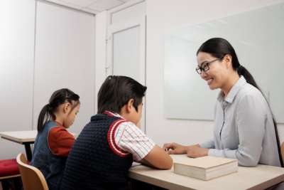 asian teacher and two students