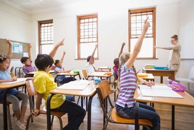 students raising hands