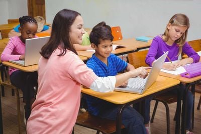 teacher and esl student discussing a task