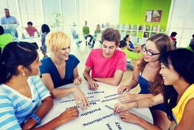 a group of people playing a table game