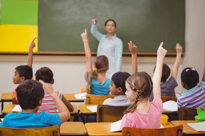 students sitting at row desks