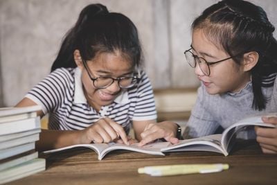 girls reading a book