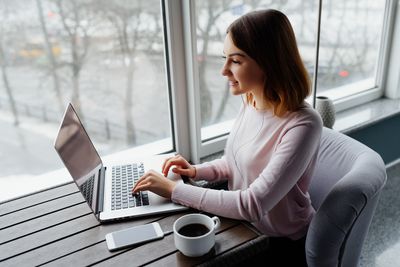 young teacher in front of the laptop