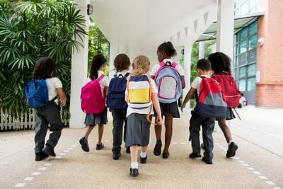 primary school schildren going to class