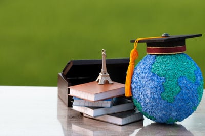 school objects and a miniature of an efel tower