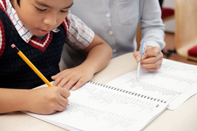 teacher tutoring a student