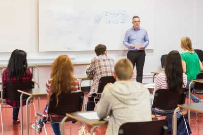 male teacher and adult students