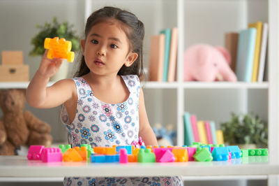 girl playing with blocks