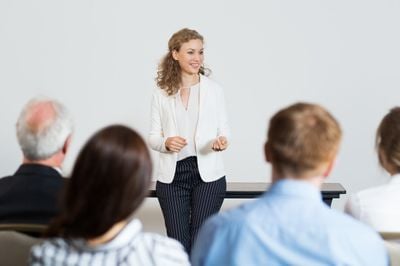 TEFL teacher giving a lecture to businessmen