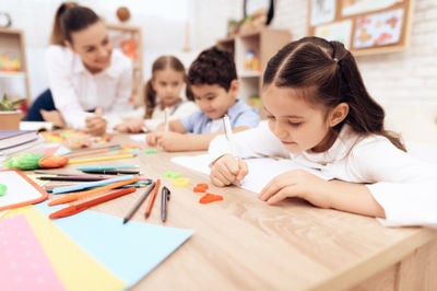 students writing at the table