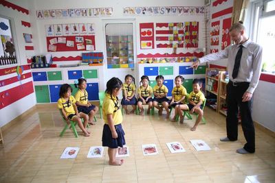 kindergarten teacher and kids