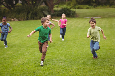 three boys running