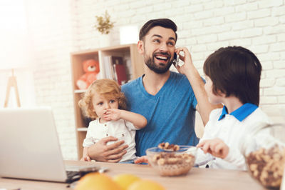 father and his sons talking