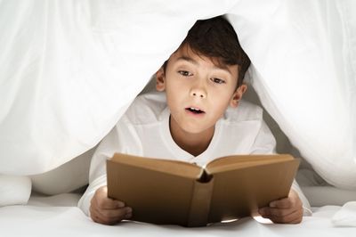 boy reading a book