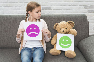 girl and a teddy bear toy