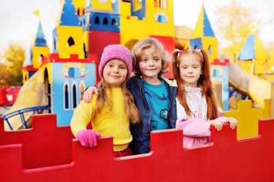 three children playing outside