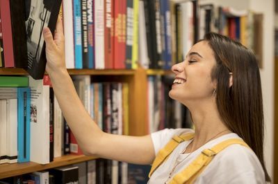 woman chooses a book