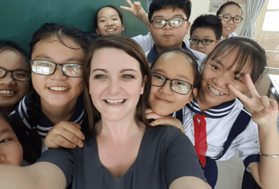 esl teacher with vietnamese students