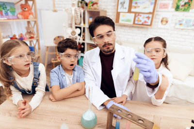kindergarten children are having a science class