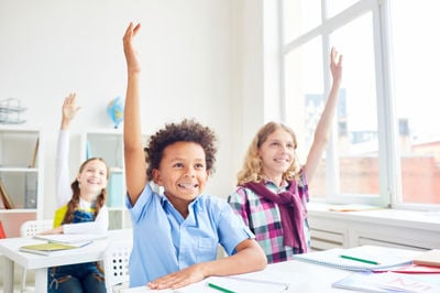 school students raise hands