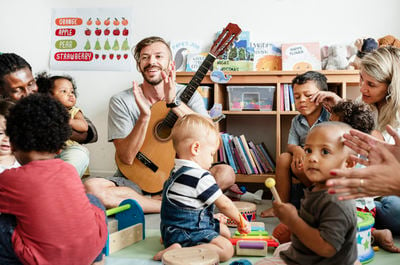 nursery children playing with musical instruments