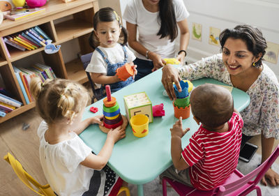 kindergarten teacher and kids