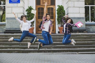 three students happy