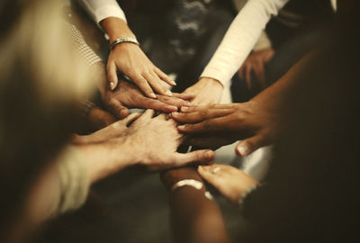 people stacking hands