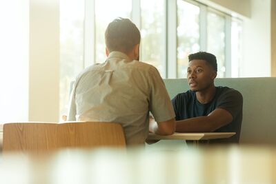 students talking to each other