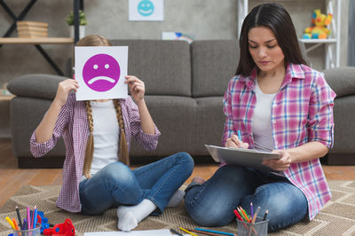 girl and teacher playing