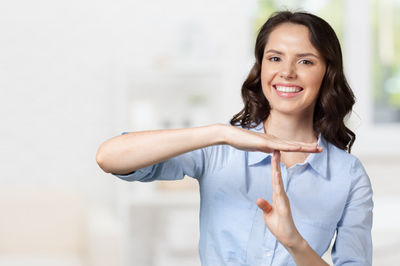 lady showing a time out sign