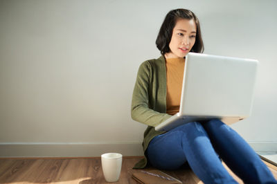 asian woman with a laptop