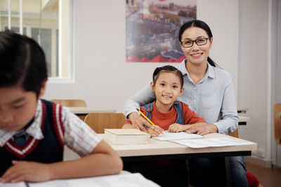 asian teacher and a young student