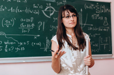 teacher by the blackboard