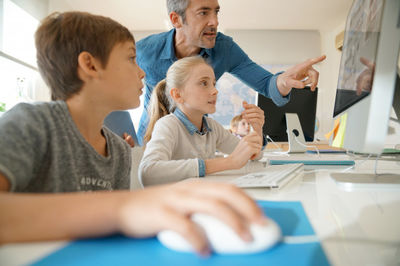 students in front of a computer