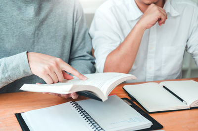 two people and a notebook