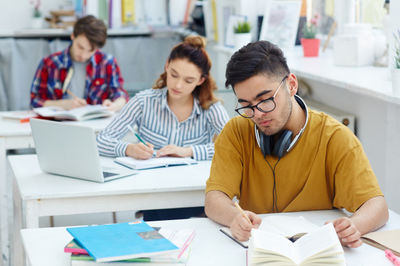 three students having a lesson