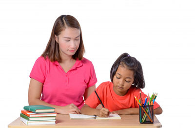 teacher helping a student