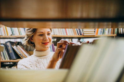 woman picking a book